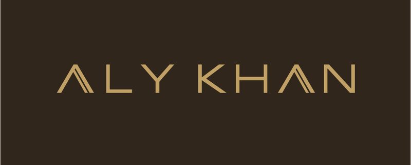 Aly Khan logo in gold on earth brown